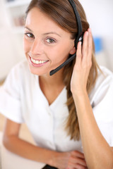Portrait of smiling nurse with headset on
