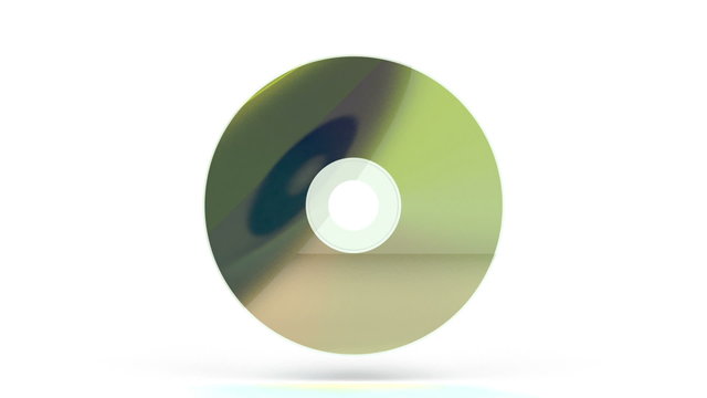 Compact disc rotates on white background