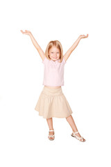 Happy little girl dancing. Isolated on white