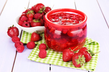 Home made berry jam on wooden table