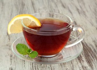 Cup of tea with lemon on table close-up