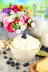 Fresh cottage cheese with blueberry on wooden table close-up