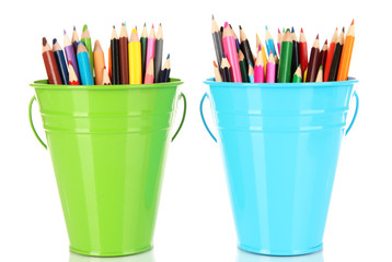 Color buckets with multicolor pencils, isolated on white