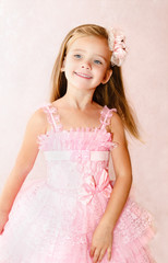 Portrait of smiling little girl in princess dress