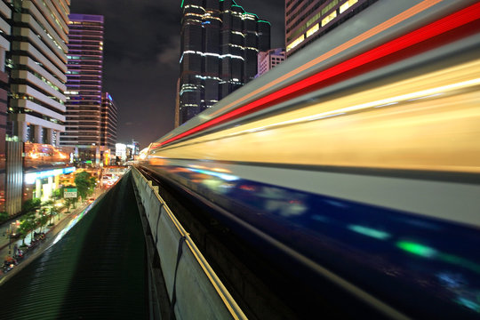 Motion of BTS sky train at night in Bangkok