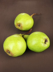 Fototapeta na wymiar Pears on wooden background