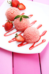 Delicious ice cream on plate on table close-up