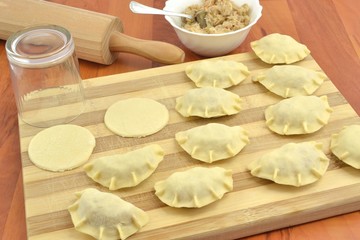 raw dumplings with sauerkraut and meat