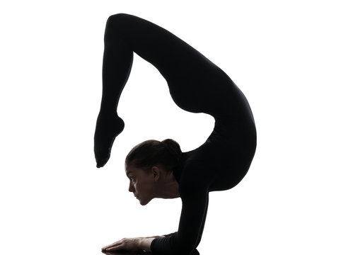 woman contortionist  exercising gymnastic yoga   silhouette - Powered by Adobe