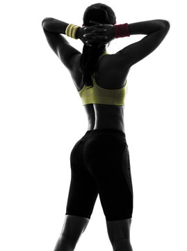 woman exercising fitness arms behind head silhouette rear view