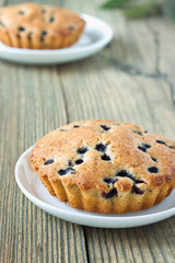 Homemade mini fresh blueberry pies on white plate