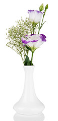 Bouquet of eustoma flowers in vase, isolated on white