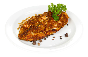 Roasted chicken fillets on white plate, isolated on white
