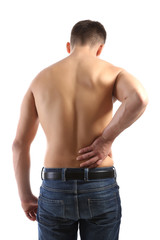 Young man with back pain, isolated on white