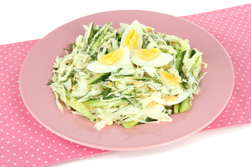 Delicious salad with eggs, cabbage and cucumbers, isolated