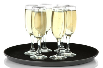 Many glasses of champagne on the tray, isolated on white