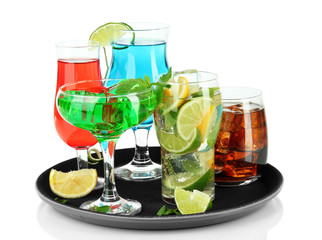 Many glasses of cocktails on tray, isolated on white