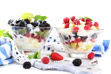 Fruit salad in glass bowls, isolated on white