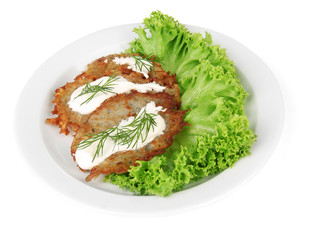 Potato pancakes on plate, isolated on white