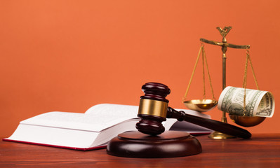 gavel, money , and scales of justice