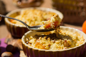 Crumble with apple, hazel nut, and violet caramel