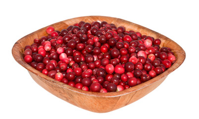 cowberry in square wooden plate. corner to the viewer.