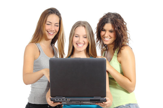 Group of teenager girls browsing internet in a laptop