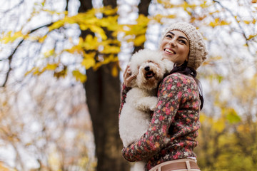 Young woman with a cute dog