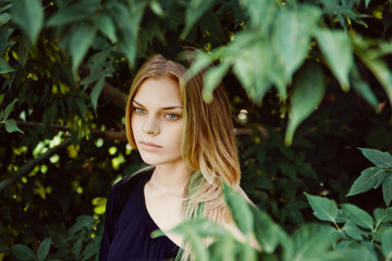 Portrait of beautiful young girl outdoors in summer