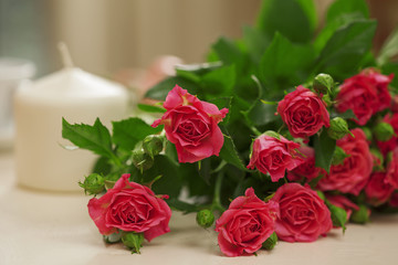 bouquet of roses and candles