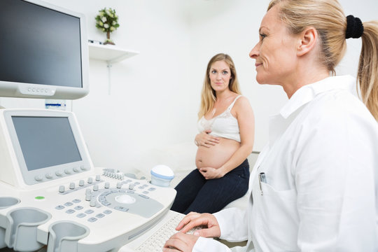 Gynecologist Using Ultrasound Machine