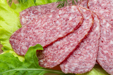 Sausages with salad and basil
