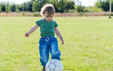 little boy playing with ball