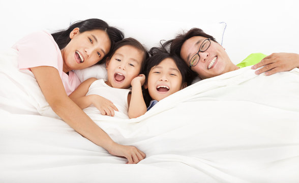 Happy   family on the bed