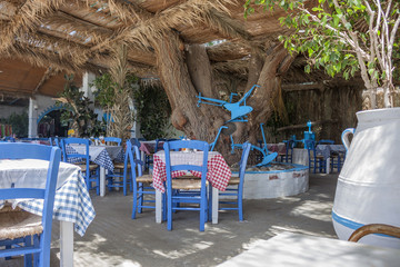typical Greek taverna with white and blue objects 