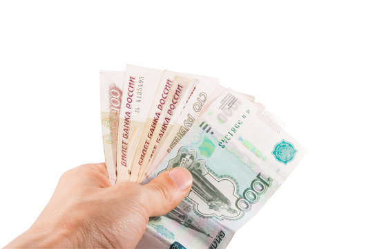Hand with russian rubles on the white background