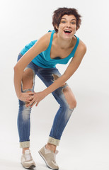 The girl in fragmentary jeans on a white background