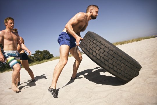 Tough Crossfit Workout On Beach