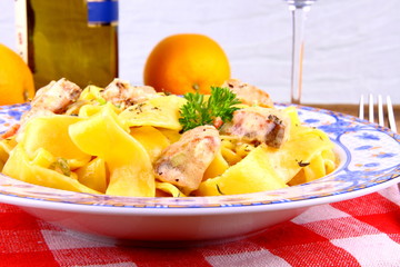 Salmon fish with taglateli, wine and orange