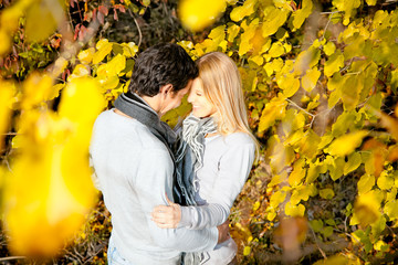 Happy couple have a romance in the fall  forest.