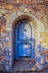 Fototapeta na wymiar Blue door in Hydra island, Greece