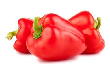 Three red sweet peppers
