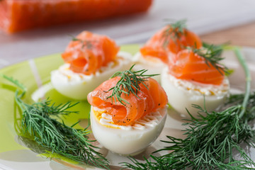 Boiled eggs with salted salmon and herbs