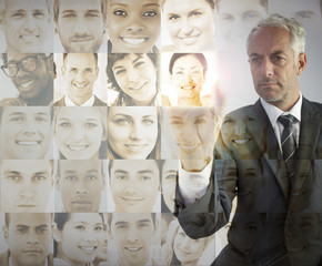 Serious businessman choosing future employees