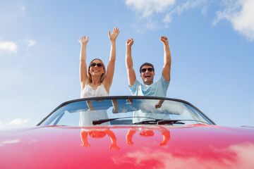 Crazy couple standing in red cabriolet - obrazy, fototapety, plakaty