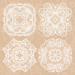Set of four lace decorative ornaments