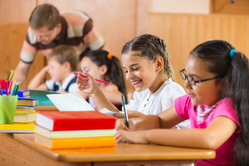 Portrait of happy pupil at lesson