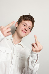 Teenager showing his middle fingers