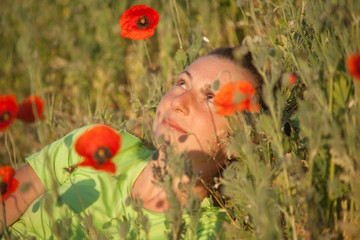 Young beautiful woman on cereal field in summer