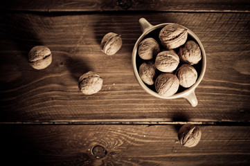 Walnuts on wooden boards. Vintage Retouch.